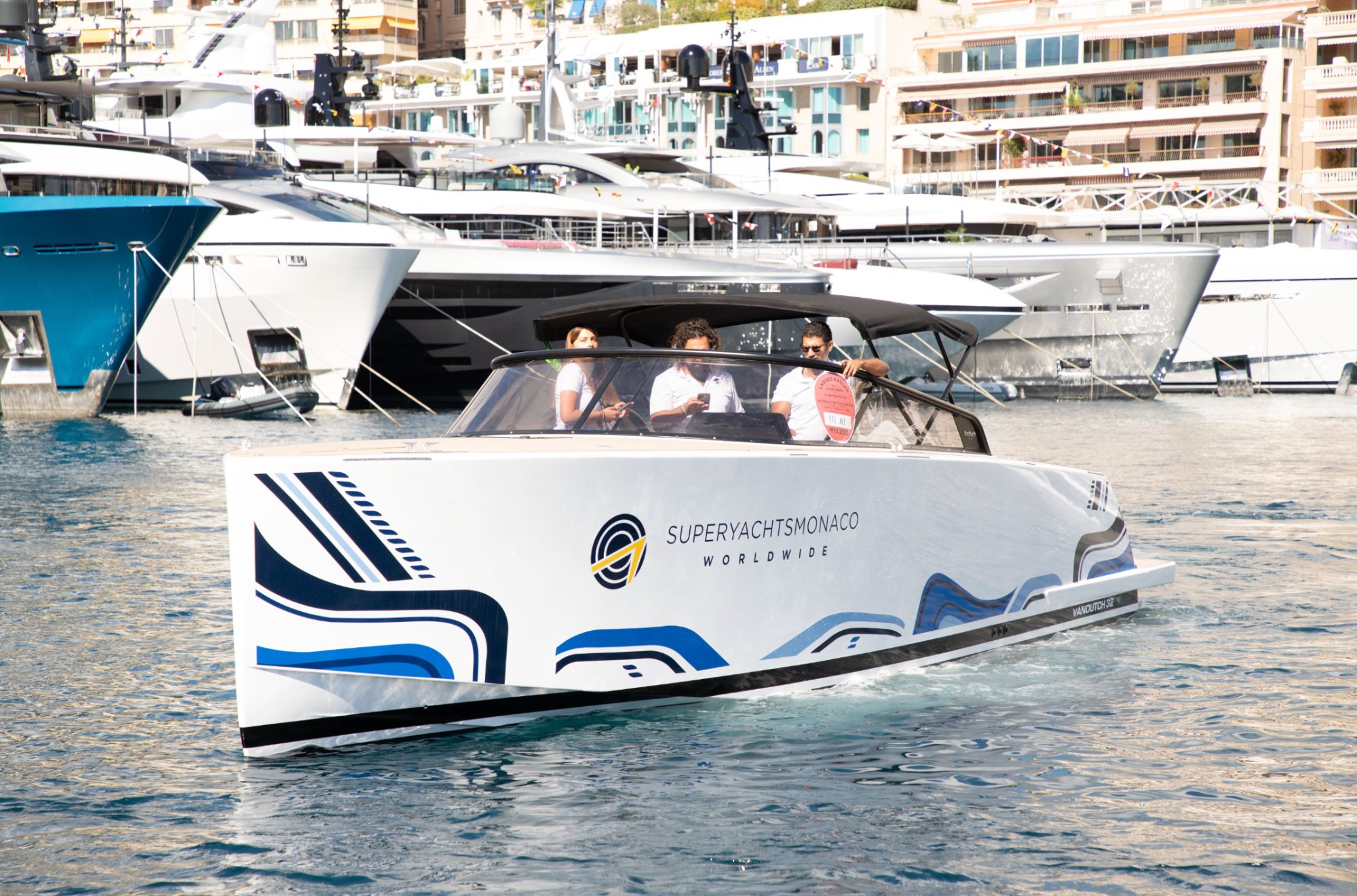 SuperYachtsMonaco branded corporate tender in Port Hercule — VanDutch 32 with campaign livery